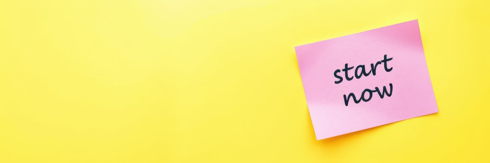 Bright yellow background displays a sticky note urging positive action with the phrase start now written in bold ink